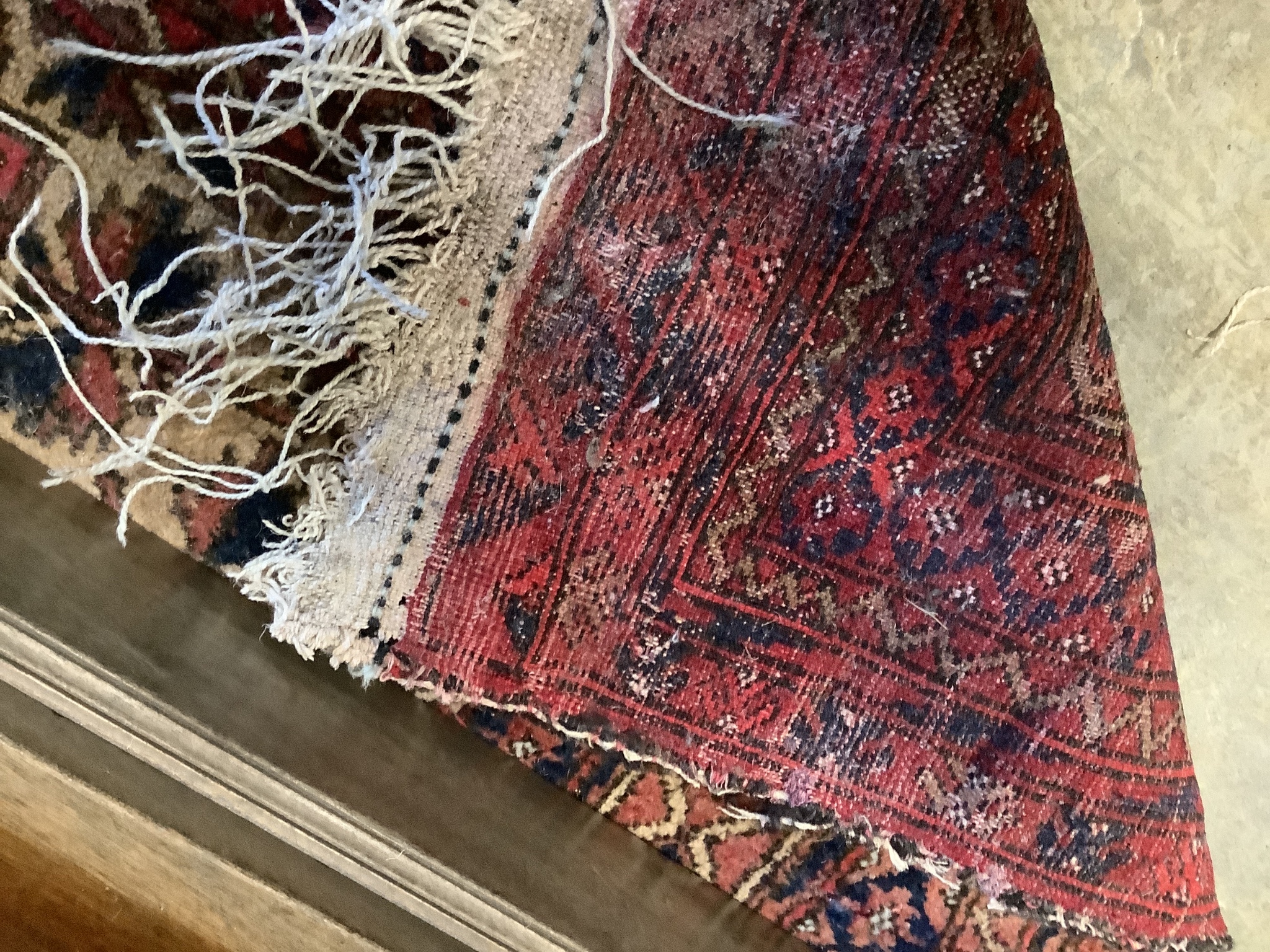 An antique Caucasian runner and a Belouch rug, larger 284 x 134cm